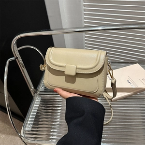 Minimalist beige crossbody flap bag with square buckle and gold hardware for women
