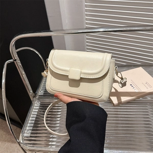 Minimalist off-white small square bag with smooth faux leather and matching buckle strap