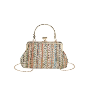 Multi-color woven shoulder bag with zigzag patterns and gold-tone metal chain handle