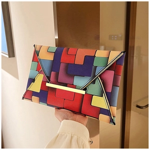 Detailed view of the envelope clutch bag with colorful geometric patterns and gold metal lock