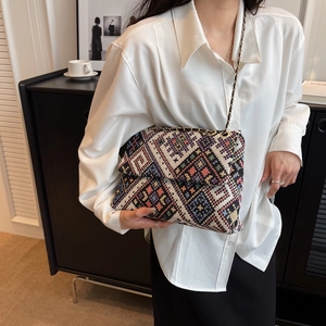 Ethnic style crossbody bag with geometric weave pattern and golden chain strap for women