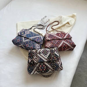 Ethnic woven crossbody bags with chain straps in navy, wine red and monochrome patterns