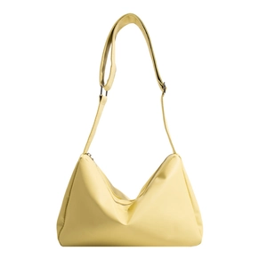 Minimalist pale yellow hobo bag with adjustable wide shoulder strap and silver hardware