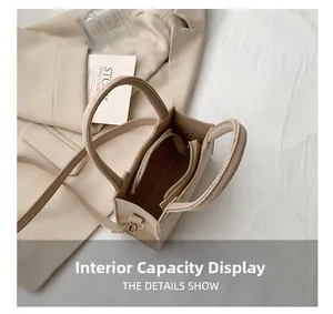 Detail showing internal storage capacity and zip lining of the beige felt square handbag