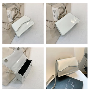 Detailed views of a white glossy crossbody bag with wavy flap and metal chain strap