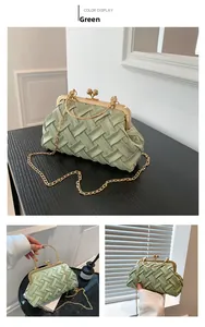 Detail of green woven texture bag with gold metal frame and vintage ball lock