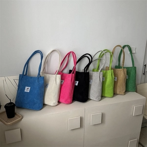 Minimalist corduroy tote bag in multiple colors with textured fabric and top handle