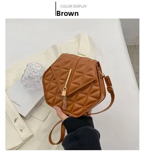 Brown PU leather crossbody bag with diamond quilting and gold tassel detailing