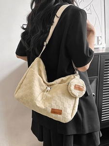 Fashion beige woven tote bag with a small round coin purse shown in a stylish indoor setting