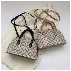 Detailed close-up of retro shell bags with clover pattern and metallic gold hardware