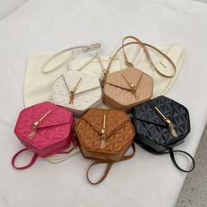 Quilted hexagon crossbody bags in five colors with tassel chain and golden metal hardware