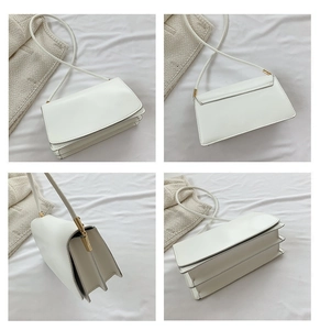 Detailed side view of a white rectangular shoulder bag showing triple-compartment gusset structure