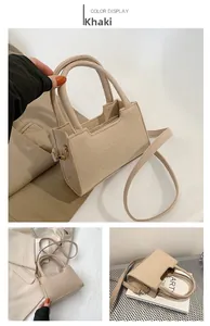 Detailed view of a khaki felt crossbody bag with adjustable straps and zipper closure