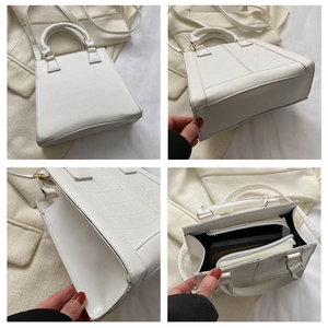 Detailed views of white minimalist crossbody bag showing croc-effect texture and inner pocket
