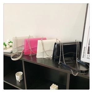Detail showing shiny PU leather small square bags with wave-cut flaps in four colors