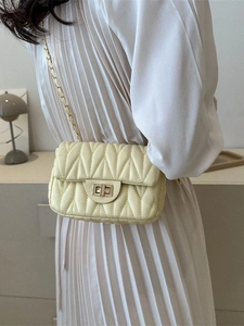 Chic quilted cream crossbody bag with gold chain strap and elegant square lock closure
