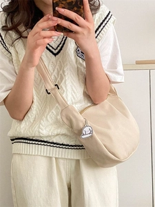 Beige corduroy crossbody chest bag with adjustable strap and cute poodle charm