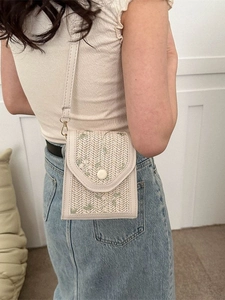 Chic woven lace crossbody bag with green floral embroidery and round magnetic buckle