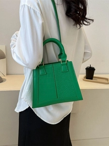 Bright green crocodile pattern mini square handbag with top handle and gold hardware