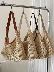 Bohemian woven straw shoulder bag featuring a hobo half-moon shape in four color options