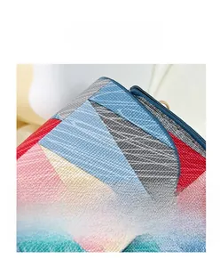 Detail shot of the pebble grain texture and multicolor geometric patchwork design