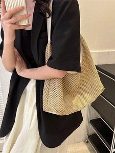 Fashionable large straw tote bag with white leather straps for summer casual wear