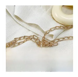 Detailed macro view of high-quality golden metal chain strap with polished finish