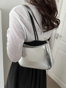 Fashionable silver metallic hobo shoulder bag with fashion and bags text in minimalist style