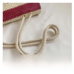 Macro detail of red and white striped woven tote with textured drawstring rope handle