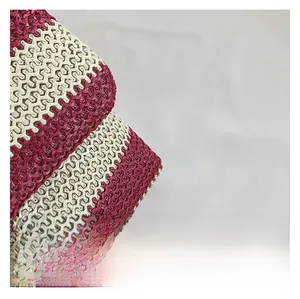 Macro detail of the woven red and white striped fabric on this summer tote bag