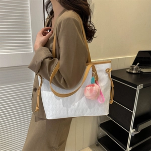 Large capacity white tote bag with brown straps and peach plush charm for daily commute