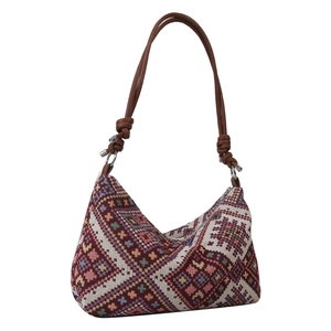 Ethnic woven canvas shoulder bag with geometric diamond patterns and brown leather strap