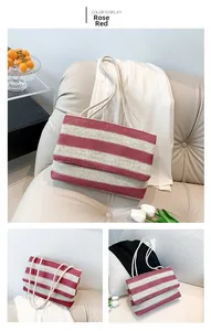 Detail of rose red striped woven tote bag with white rope handles in a modern home setting