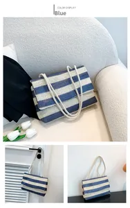 Detail of blue and beige striped woven tote bag with white dual rope shoulder straps