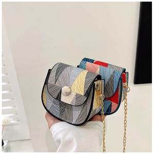 Detail of mini geometric color-block crossbody bags with fine texture and gold chains