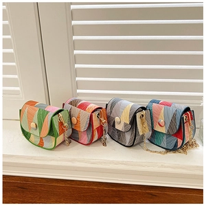 Detailed row of geometric color-block crossbody bags with gold chain straps and pop art design