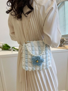 Blue and white striped seersucker tote bag with pearl handle and floral accent