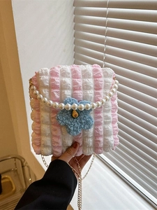 Pink and white pleated bubble tote bag with blue flower accent and pearl strap
