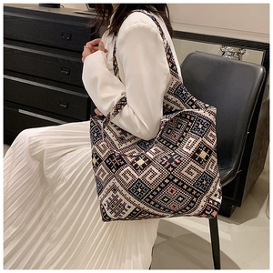 Close-up of bohemian geometric jacquard weaving on the large capacity tote bag