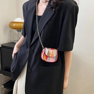 Fashionable summer mini crossbody bag with colorful geometric stripes and a gold chain strap