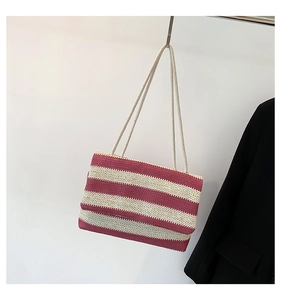 Detail of burgundy and beige striped woven tote bag with soft cotton rope shoulder straps