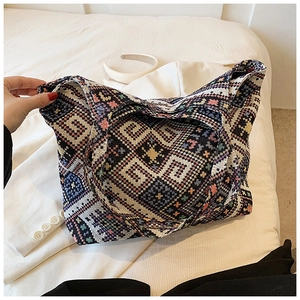 Close-up of ethnic woven pattern on high-capacity tote bag with colorful geometric textures