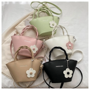 Detailed collection of mini leather tote bags in green, pink, white, khaki, and black
