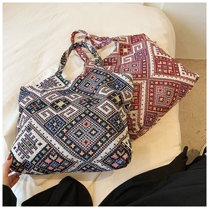 Detail of two ethnic woven tote bags with geometric patterns and large capacity design