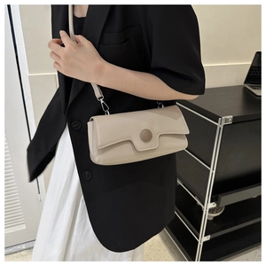 Minimalist beige rectangular flap shoulder bag with a decorative round buckle detail