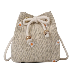 Fashionable woven drawstring bucket bag with daisy embroidery and shoulder strap