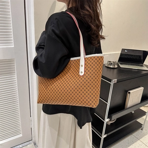 Classic light brown tote bag with vintage circular pattern and white shoulder straps