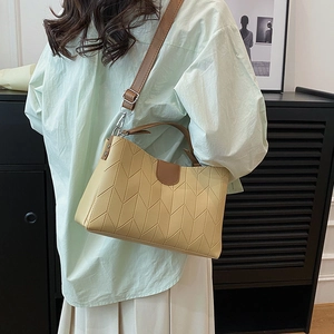 Minimalist chevron quilted crossbody tote bag in cream yellow with brown leather straps