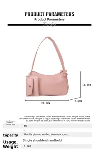 Detail view of a pink PU leather crescent shoulder bag with bow and small coin purse