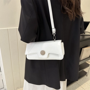 Chic white baguette shoulder bag for women featuring sleek leather and silver metal buckles